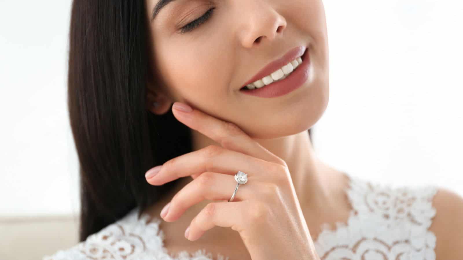 Young bride wearing beautiful engagement diamond ring