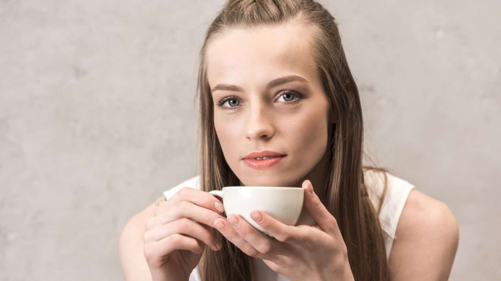 Young woman drinking coffee