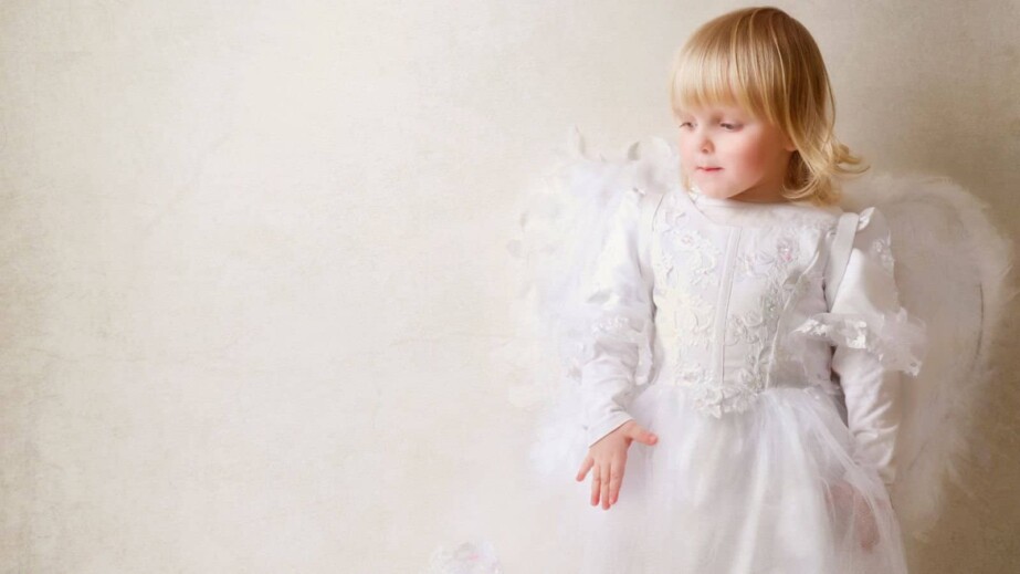 baby girl in an angel dress