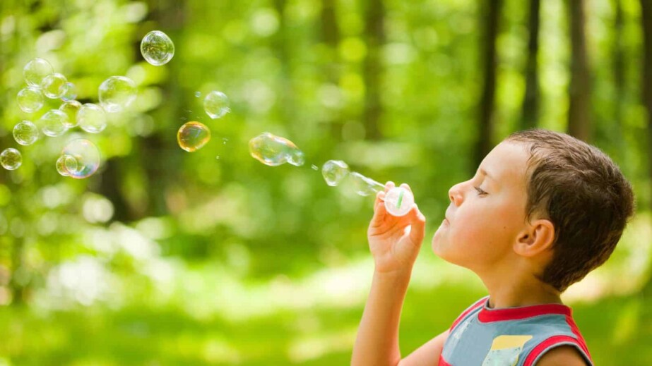 boy kid blowing bubbles
