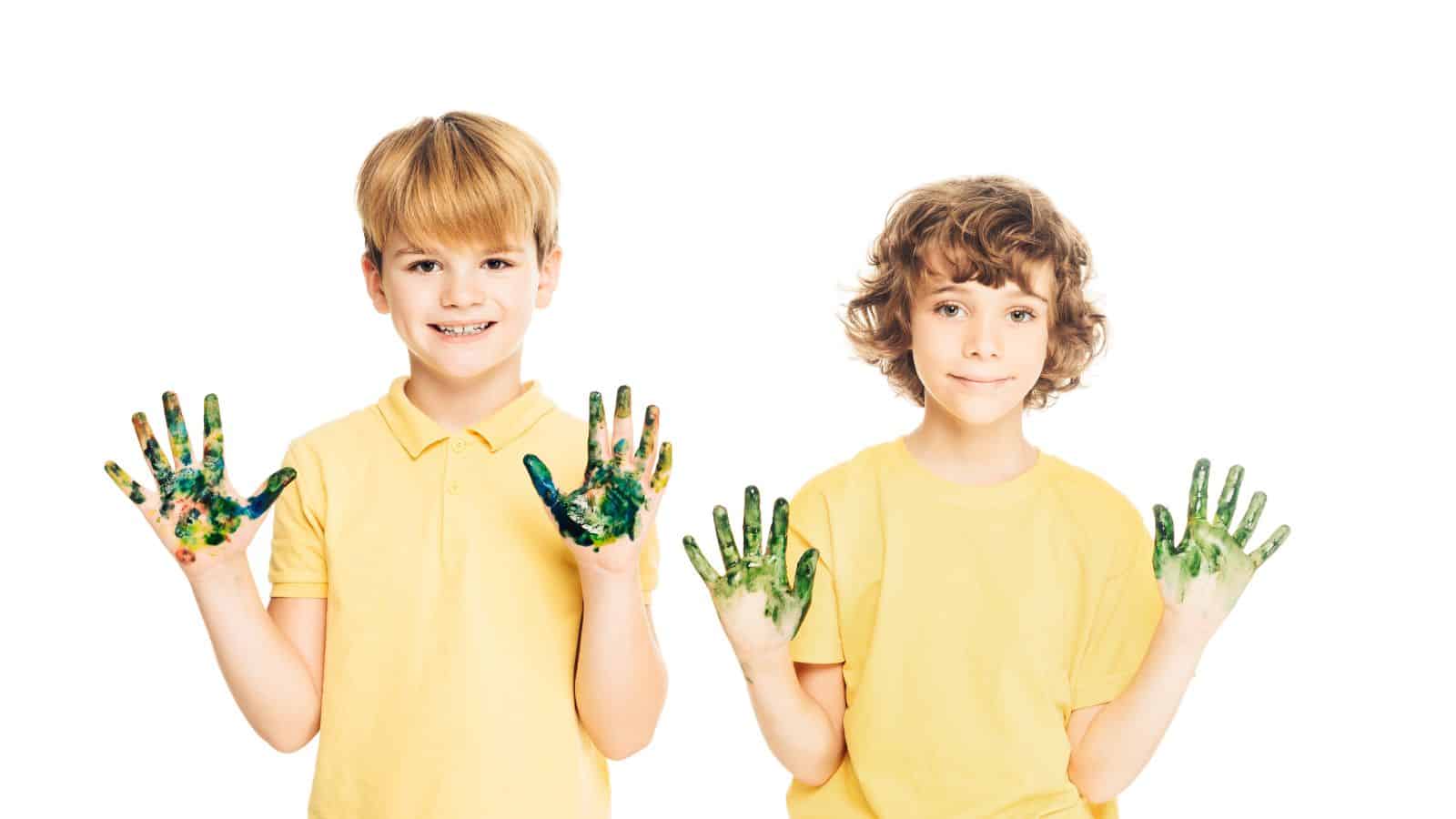 boys children fingerpainting