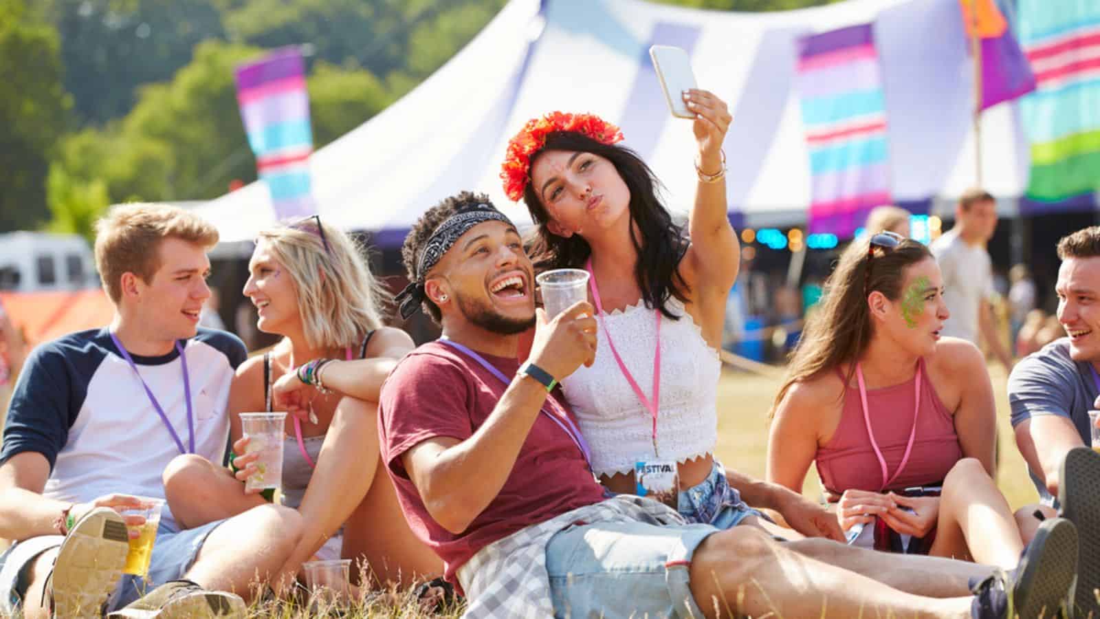 couple taking selfie at a music festival