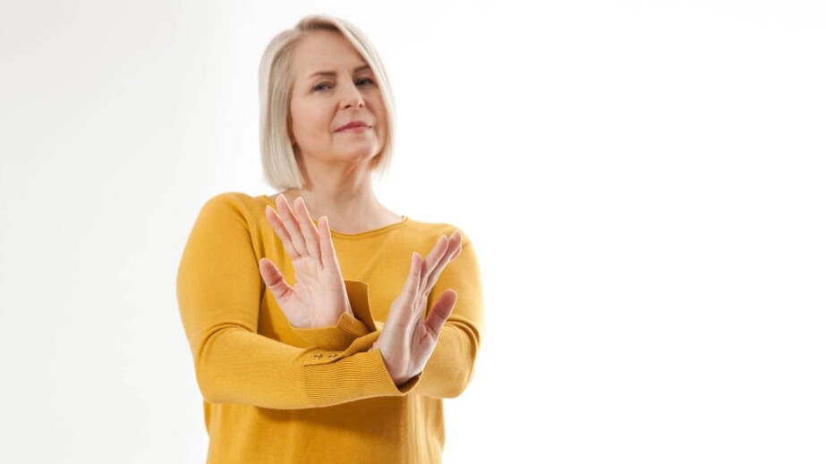 excited woman showing the sign of stop