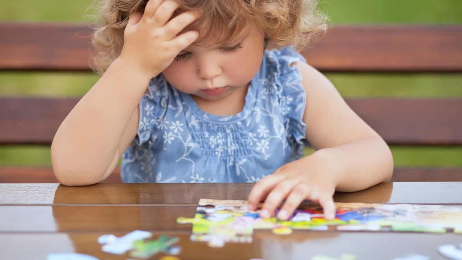 kid playing puzzle