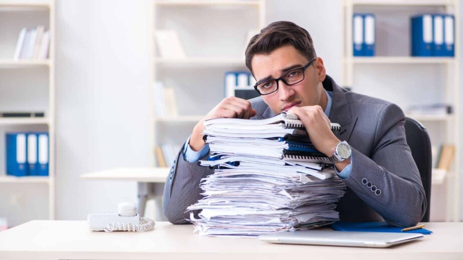 overloaded with work employee under paperwork burden