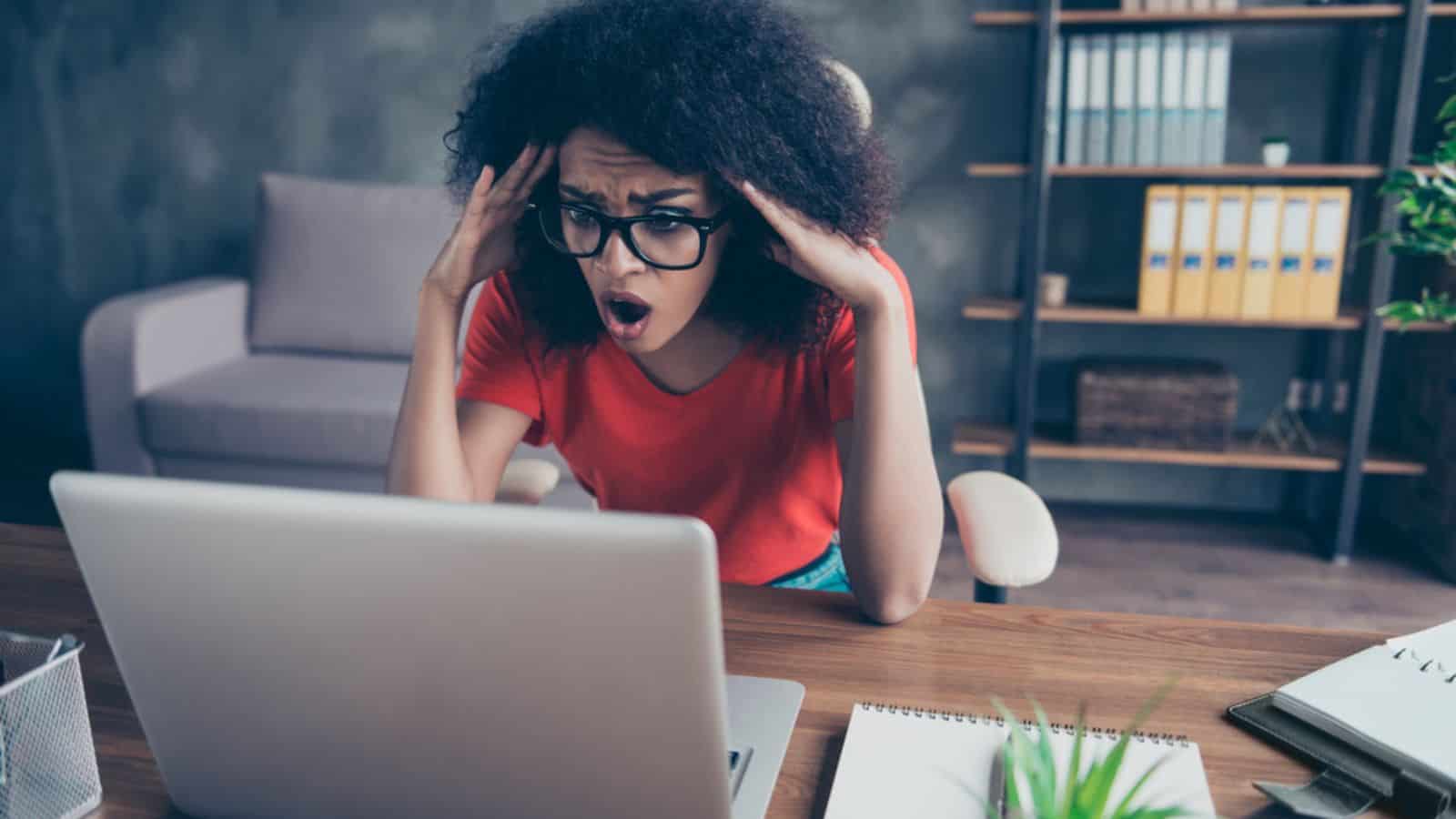 shocked stress woman with laptop